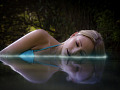 woman laying down, sleeping in the water